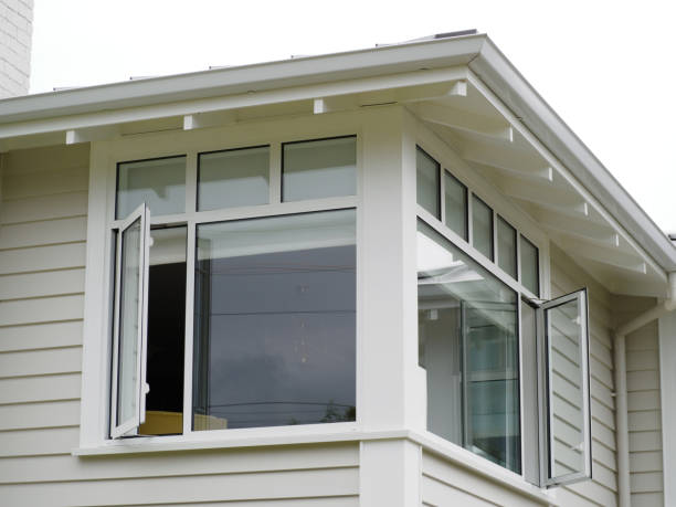 Outside view of corner window. Wooden weatherboard house.